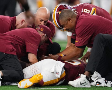 Commanders QB Jayden Daniels injures the same left elbow he dislocated last year