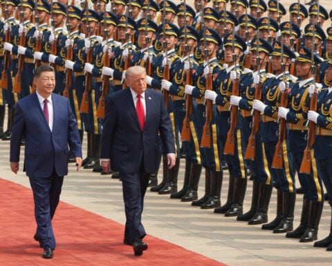 Trump decries Democrats as 'communists,' even as he looks to impress China's communist leader