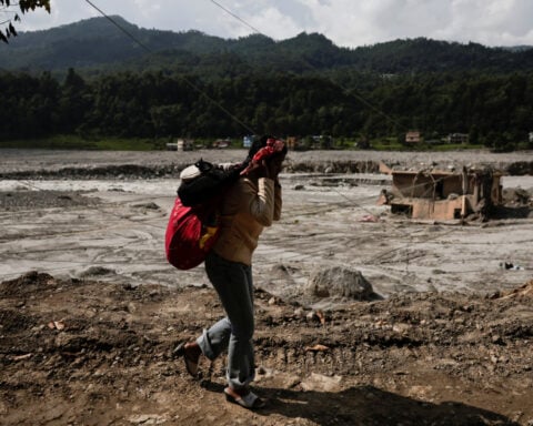 In a Nepal town, flood survivors find little trace of former lives