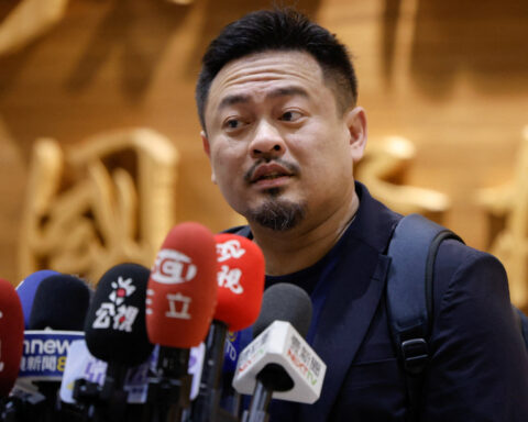 Taiwan minister says he was not 'belittled' on rare trip to China