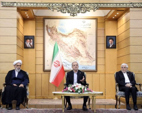 Trump says talks with Iran continue and he thinks settlement will be reached