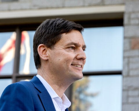 British Columbia leader calls snap election as premier tells voters to say ‘hell no to Trump’