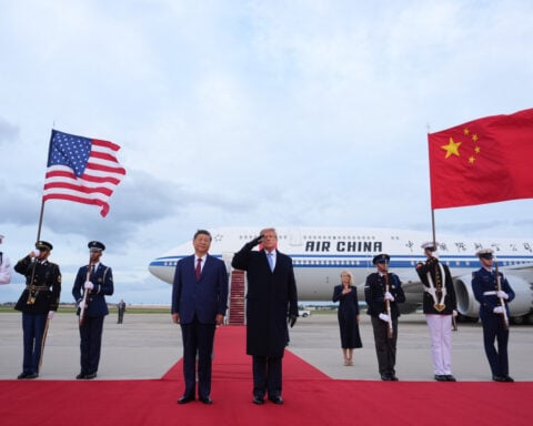 Trump welcomes China's Xi to Washington with planeside ceremony and extension of trade truce
