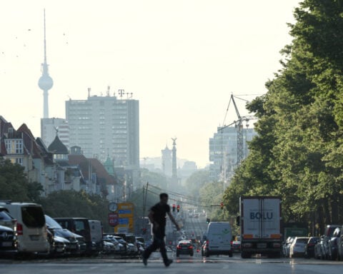 German institutes lift growth forecasts, business morale rises