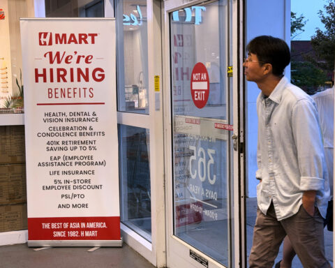 Claims for unemployment benefits drop to 197,000, the lowest since mid-July as layoffs remain rare