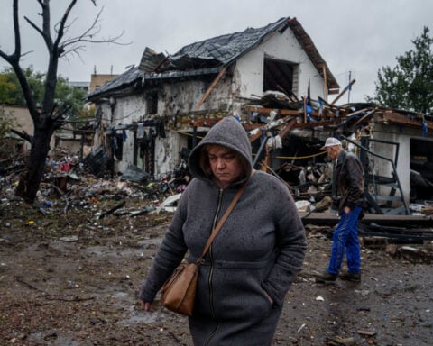 Russian strikes kill 8 in Ukraine as the UN debates how to end the war