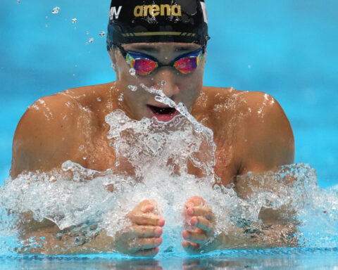 Shin Ohashi of Japan sets world record in 200-meter breaststroke at the Asian Games