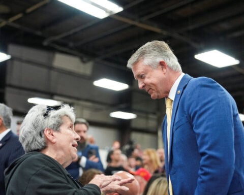 Rush of money, campaign stops show Republicans feel vulnerable in Iowa, Kansas