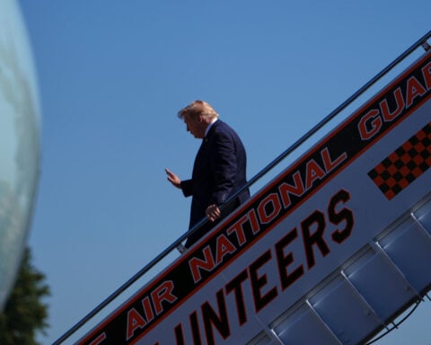 CNN says it was left off Air Force One for Trump's Saturday trip to a college football game