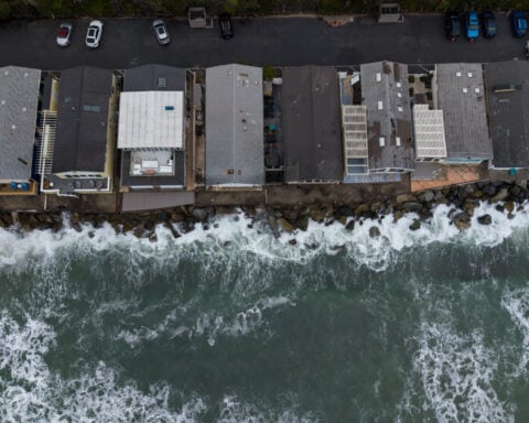 Sea level rise is reshaping a California beach town and threatening a key rail line