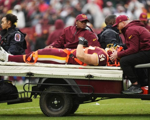 Washington LB Leo Chenal carted off with a neck injury against Seattle