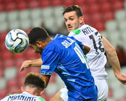 Ireland players wear black armbands and refrain from handshakes in soccer game against Israel