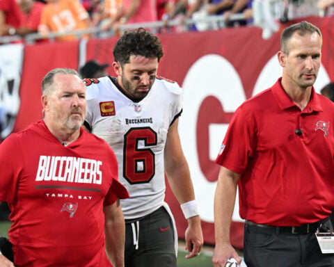 Baker Mayfield dislocates thumb on throwing hand and winless Buccaneers await results of MRI