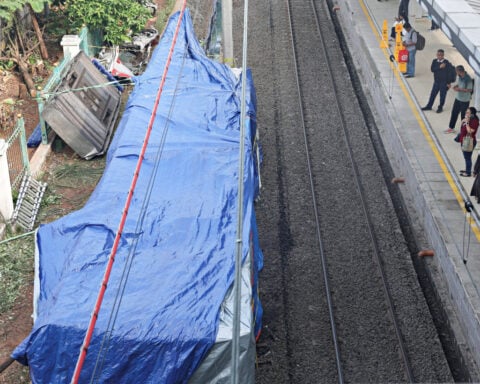Signal faults and communication problems caused Indonesia's deadly train collision, investigators say