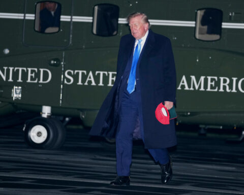 The Latest: Trump administration lowers fuel economy standards