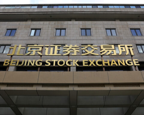 China stocks end higher on policy support pledge