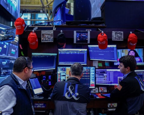 Equities end slightly lower as bond yields hold near multi-decade highs