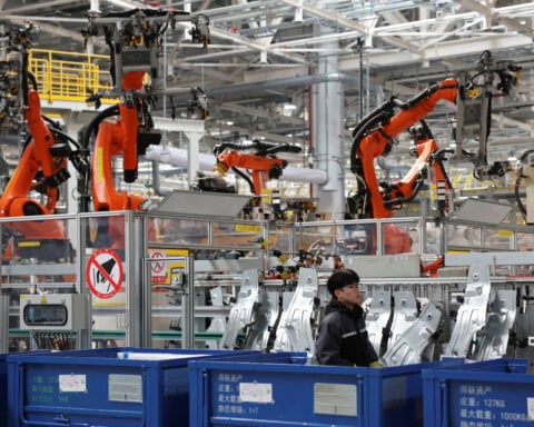 China's factory activity returns to growth in September amid AI boom