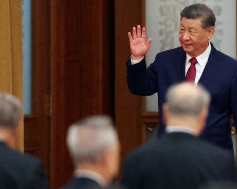 China's Xi talks economy, Taiwan at reception marking National Day