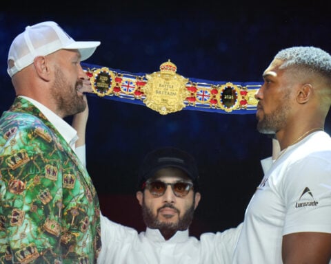 Fury and Joshua are mostly smiles as they take stage together ahead of Cardiff bout