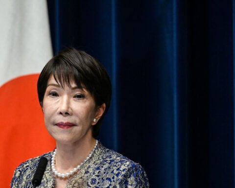 Japan PM vows to underpin yen by boosting economic competitiveness
