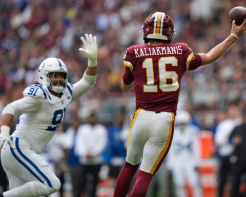 Taylor runs for 2 TDs and Colts beat Commanders 30-13 in London