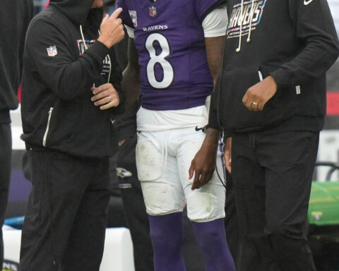 Lamar Jackson sits out 2nd half with a sprained left ankle that the Ravens hope isn't too severe