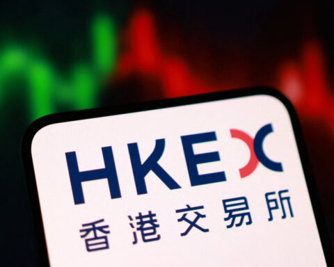 Hong Kong stocks tick down in thin trade as property, financials drag
