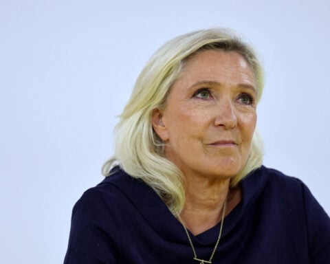 Le Pen eyes bond markets with promise of bigger spending cuts if far right wins presidency