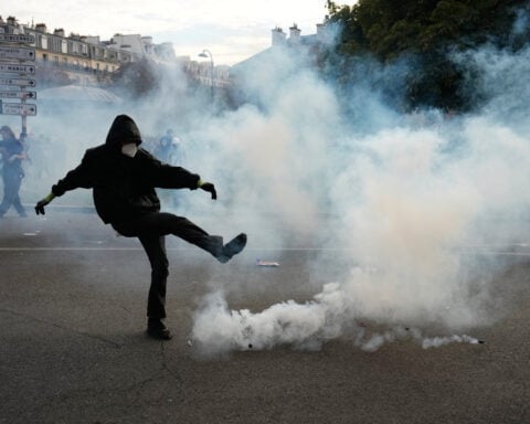 French riot police fire tear gas as more than 250,000 rally nationwide for school funding