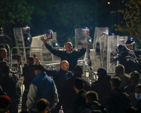 Kosovo lawmakers elect a new president in a late-night vote to avert snap election
