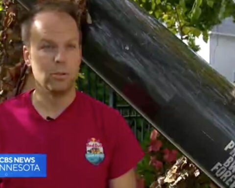 Twin Cities Marathon runner carries canoe on his back to highlight Boundary Waters as mining debate heats up