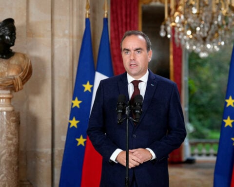 France suspends use of stun grenades to police student protests