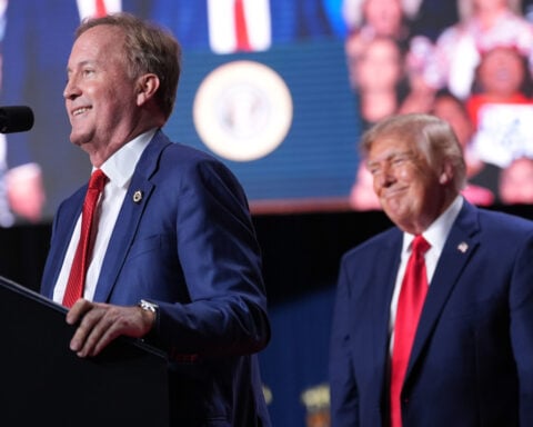 Trump interrupted by protesters as he fights to rally Texas voters behind Paxton in US Senate race