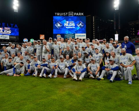 Pages delivers go-ahead single in 7th as Dodgers beat Braves 4-1 to clinch NL Division Series