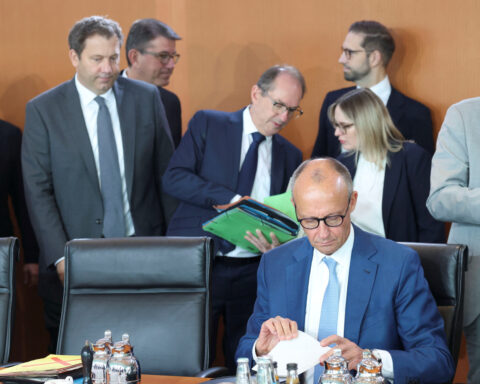German coalition affirms reform agenda amid 'historic test' for democracy