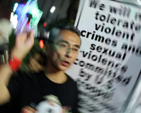 Dozens protest in Tokyo after Marine accused of murder in Okinawa