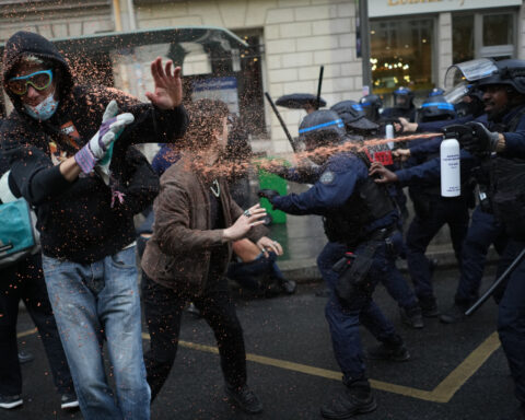 Police fire tear gas at barricaded Paris high school as student protests show no sign of ending