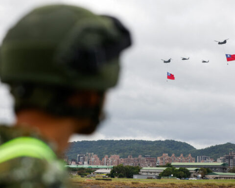 Giant Taiwan flag flies from helicopter for national day, defying Beijing