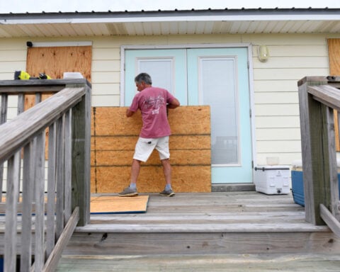El Niño's storm-killer winds and climate's warming waters in fight over future of Hurricane Isaias