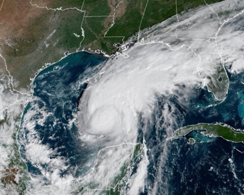 Georgia-Alabama showdown is on schedule despite arrival of Hurricane Isaias; Trump will skip game