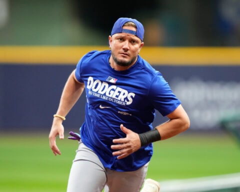 Dodgers keep infielder Miguel Rojas on their NLCS roster against the Brewers