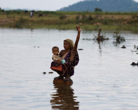 As rising waters flood homes and temples, villagers protest India's $87 billion river-linking project