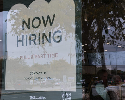 The number of Americans filing for jobless aid remain at historically low levels below 200,000