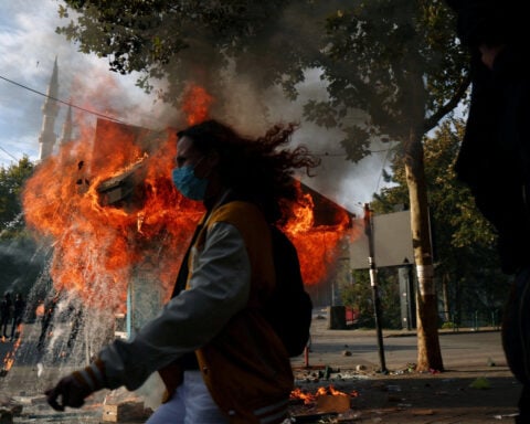Albania's leader defies calls to resign as student protesters rampage in capital