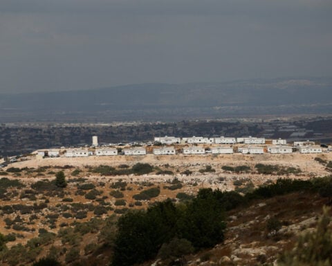 China says Israel should stop its 'forced establishment' of West Bank settlements