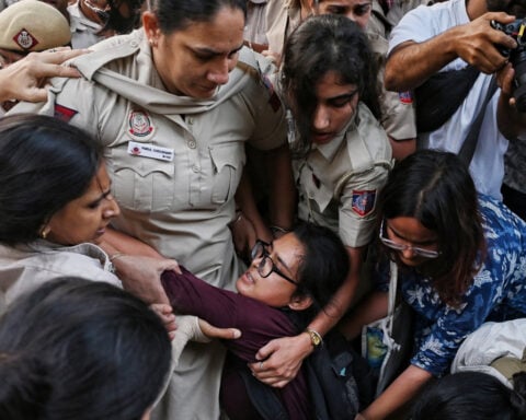 Crowds throng New Delhi and wave Indian flags amid escalating protests