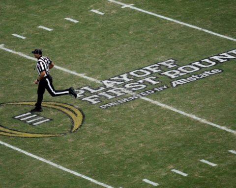 'Handshake agreement' with ESPN brings college football closer to a 24-team playoff, AP source says