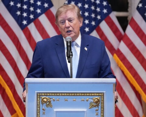 Trump puts new Russia sanctions that he recently signed into law on hold, citing national interest