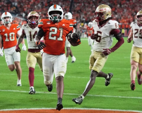 No. 3 Miami hangs on to beat Florida State, 43-35 in a double-overtime thriller